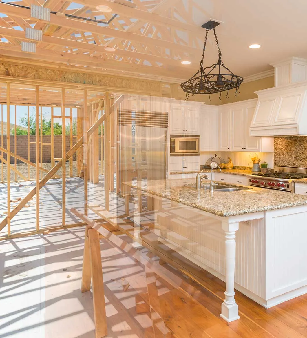A home shown mid-transformation, from open framing into a finished, furnished kitchen